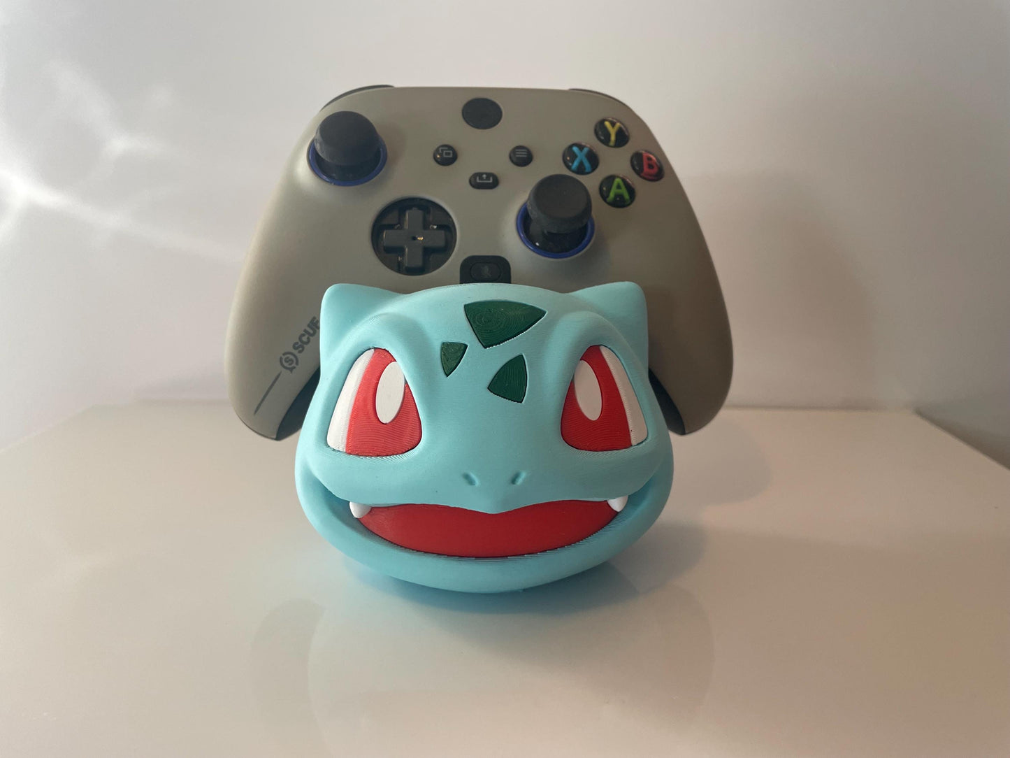 Pokémon's Bulbasaur controller holder fits all sized controllers NOT ASSOCIATED with Pokémon